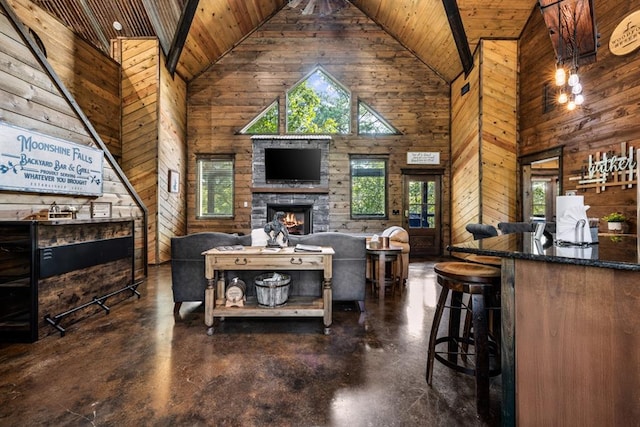 living room featuring high vaulted ceiling and a wealth of natural light