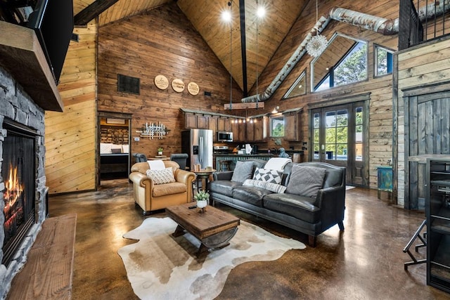 living room featuring wood ceiling, wooden walls, high vaulted ceiling, beamed ceiling, and a stone fireplace