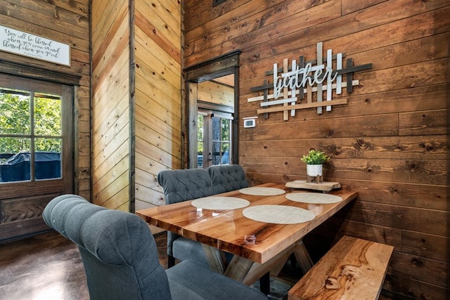 dining area with wood walls