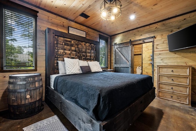 bedroom featuring a barn door, wooden walls, wood ceiling, and multiple windows