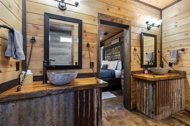 bathroom with wood walls, vanity, concrete flooring, and wooden ceiling