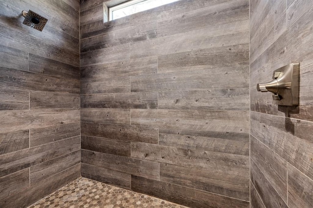 bathroom with tiled shower