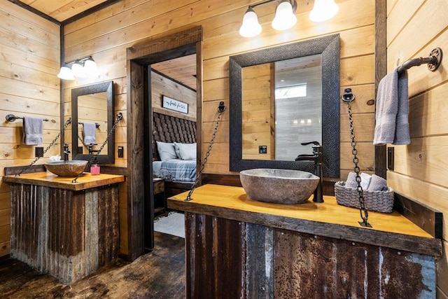 interior space featuring wooden walls, vanity, and concrete flooring