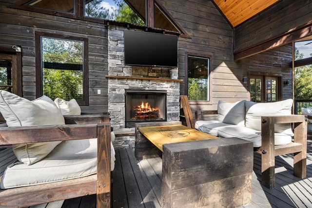 wooden deck featuring a fireplace