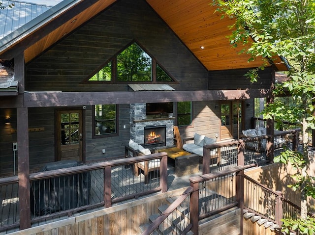 wooden terrace featuring a fireplace