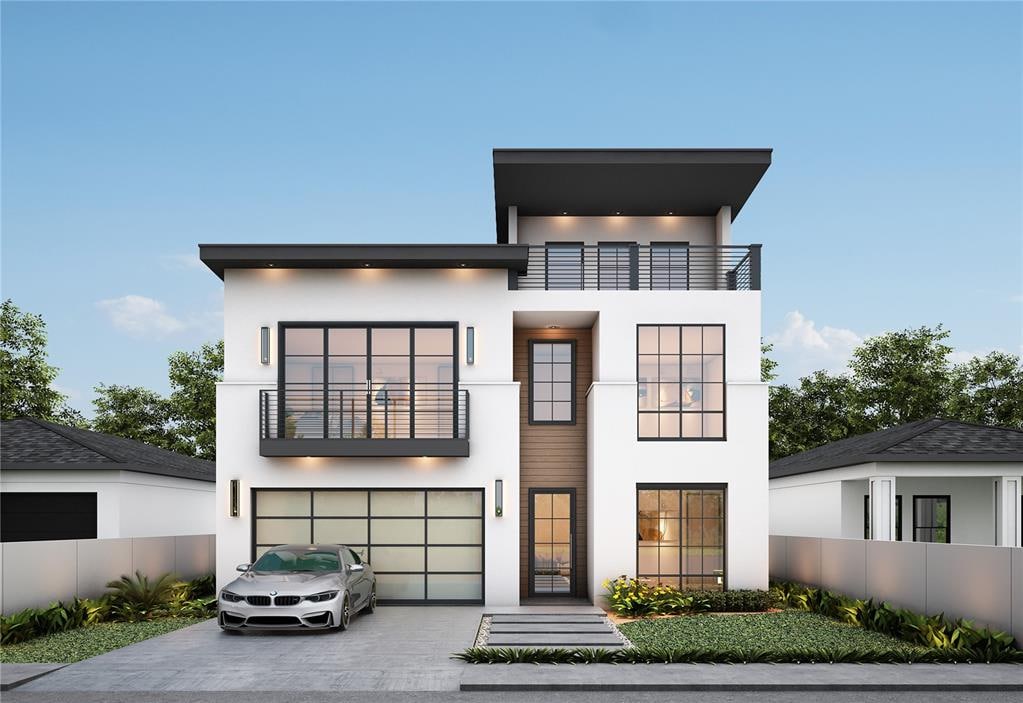 contemporary home featuring a garage and a balcony