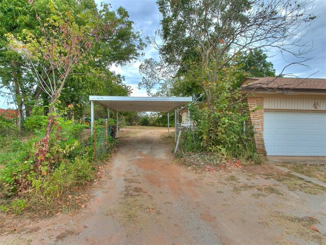 exterior space with a carport and a garage