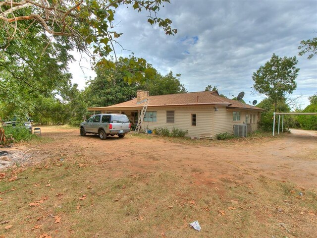 exterior space featuring central AC unit