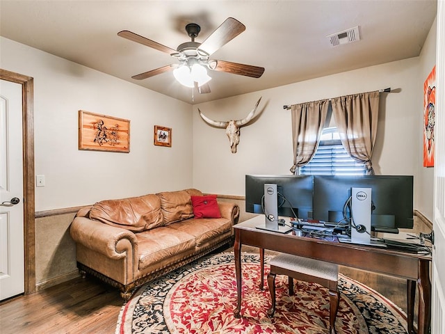 office with ceiling fan and hardwood / wood-style floors