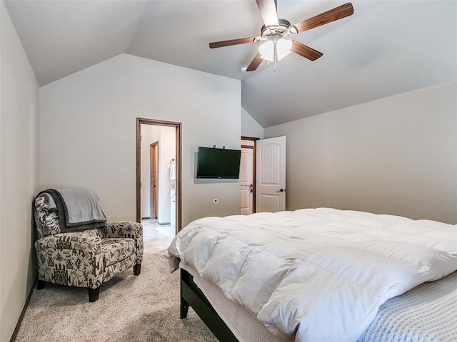 carpeted bedroom featuring ceiling fan and vaulted ceiling