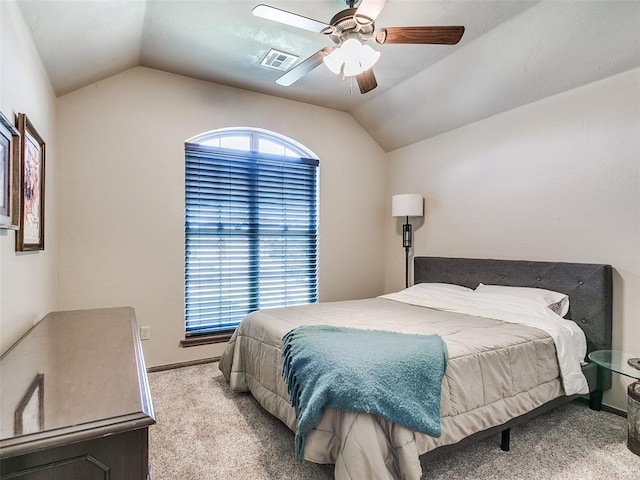 bedroom with light colored carpet, ceiling fan, and lofted ceiling