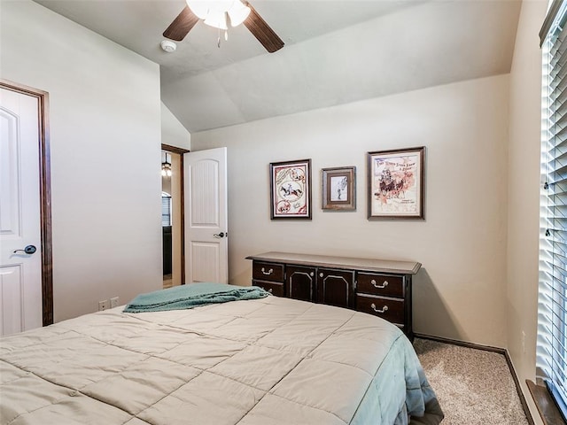 bedroom featuring ceiling fan, light carpet, and vaulted ceiling