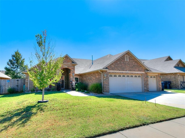 ranch-style house featuring a front yard and a garage