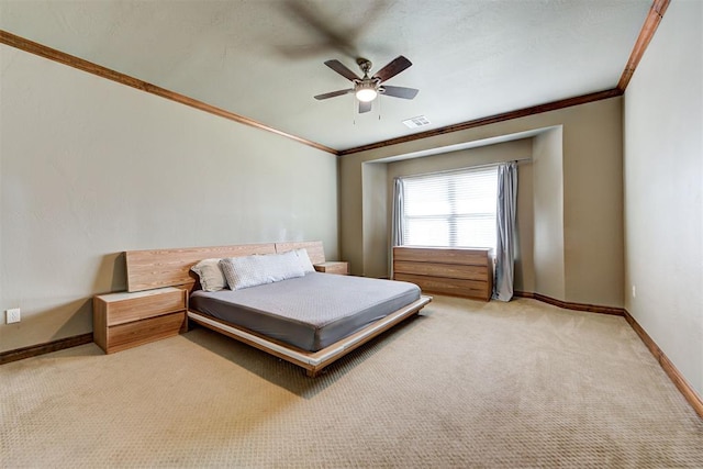 bedroom with ceiling fan, light carpet, and ornamental molding