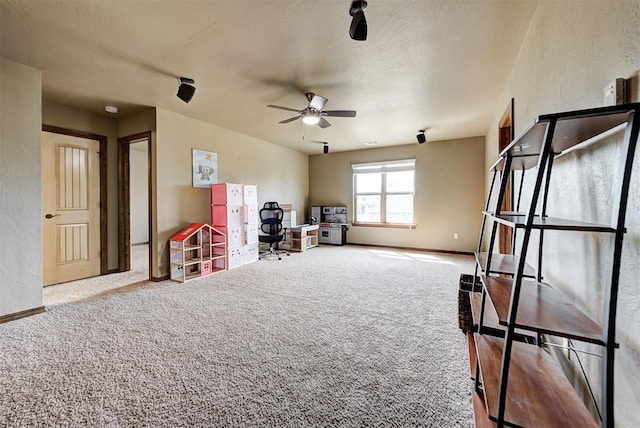 miscellaneous room featuring carpet flooring and ceiling fan