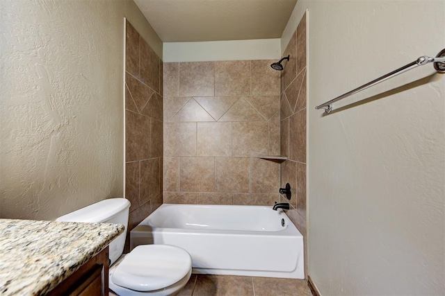 full bathroom with vanity, tiled shower / bath combo, toilet, and tile patterned flooring