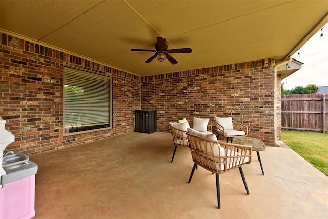 view of patio / terrace with ceiling fan and an outdoor living space