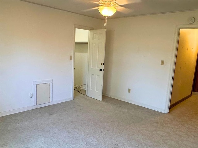 unfurnished bedroom with light carpet and ceiling fan