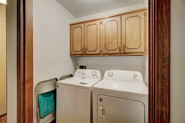 laundry area featuring cabinets and independent washer and dryer