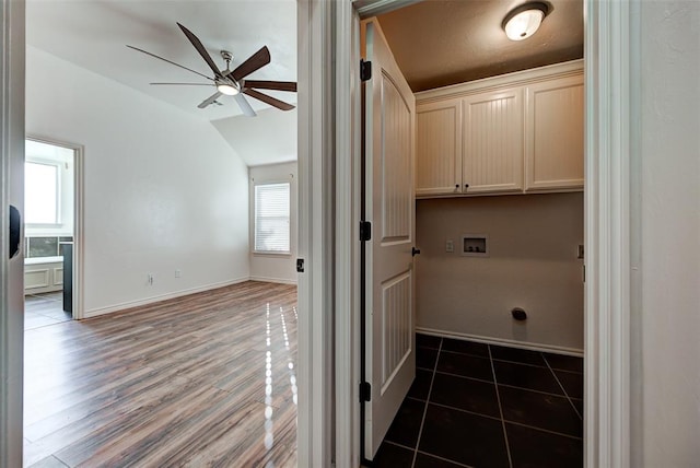 laundry room with ceiling fan, dark wood-type flooring, cabinets, and washer hookup