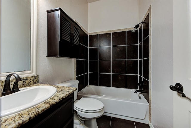 full bathroom with toilet, vanity, tile patterned floors, and tiled shower / bath