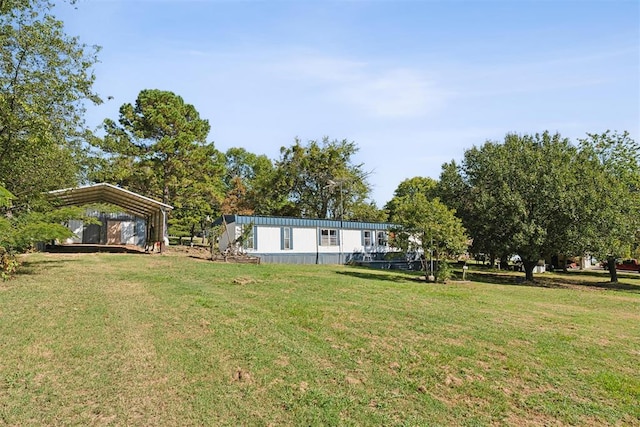 view of yard with a carport