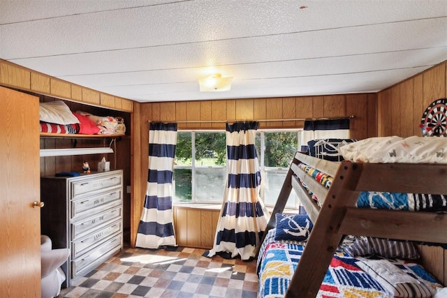 bedroom with wooden walls