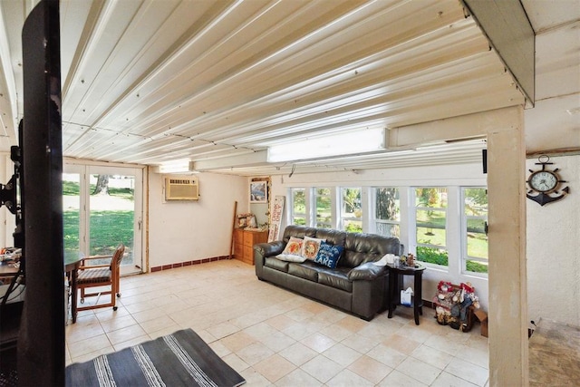 sunroom with a wall mounted air conditioner