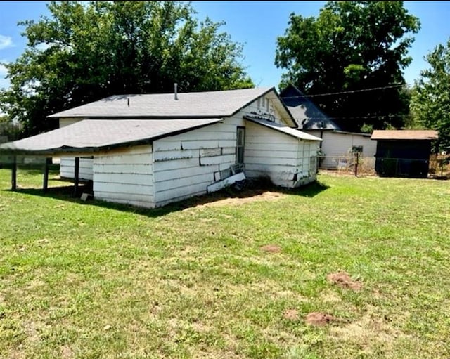 view of property exterior featuring a lawn