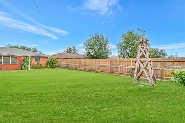 view of yard featuring a fenced backyard