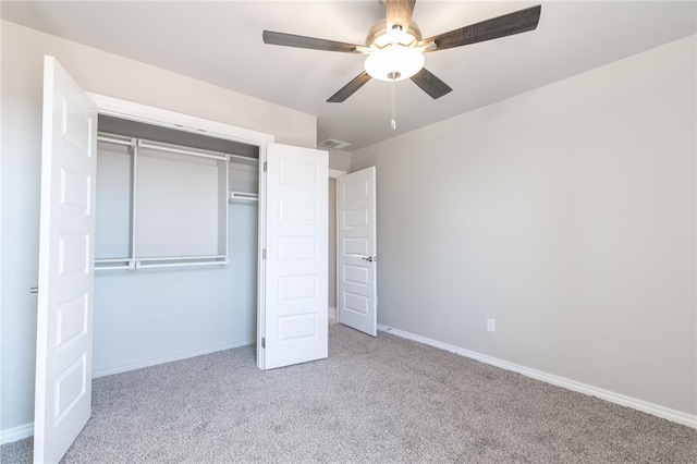 unfurnished bedroom featuring a closet, baseboards, visible vents, and carpet flooring