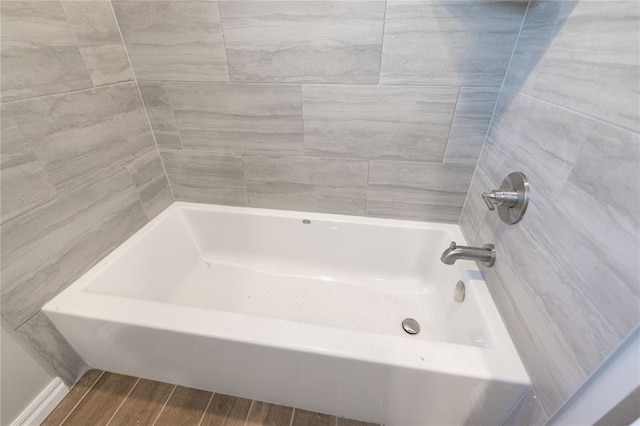 full bath with wood finish floors