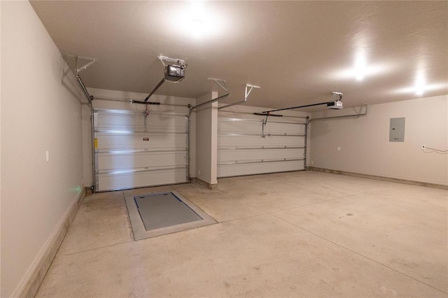 garage with electric panel, baseboards, and a garage door opener