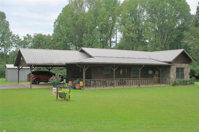 view of home's community featuring a lawn and a storage shed