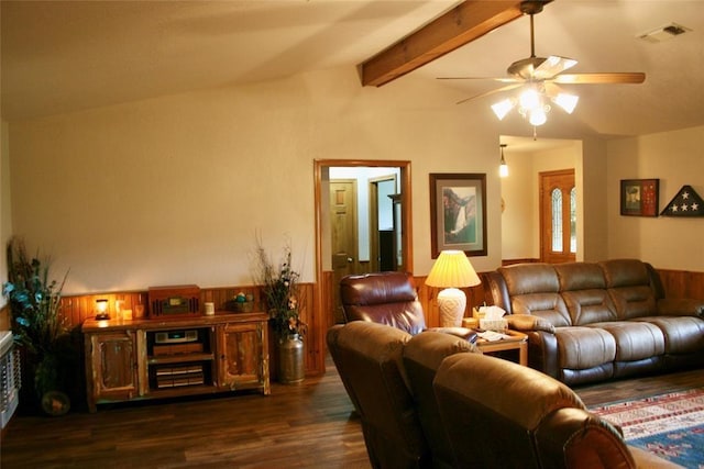 living room with lofted ceiling with beams, wooden walls, ceiling fan, and dark wood-type flooring