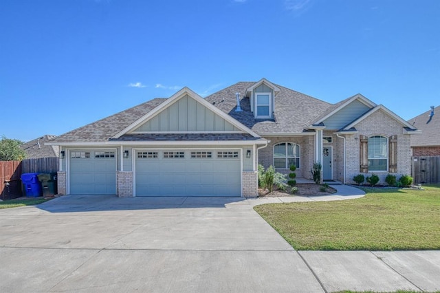 view of front of house featuring a front lawn and a garage