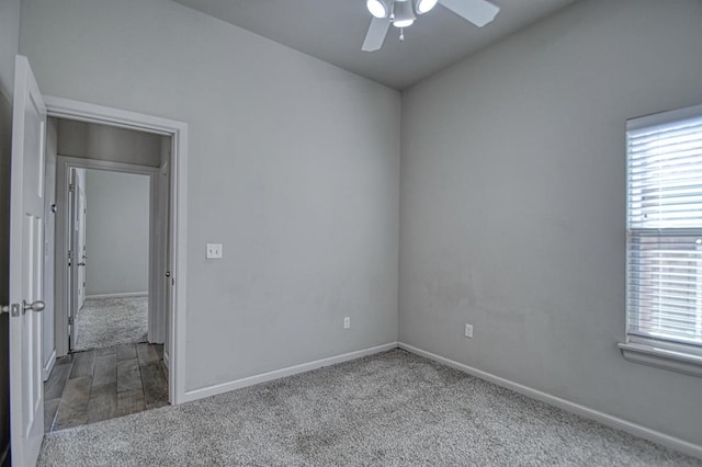 spare room featuring hardwood / wood-style flooring and ceiling fan