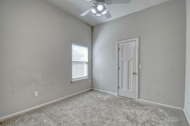 unfurnished room featuring ceiling fan and light colored carpet