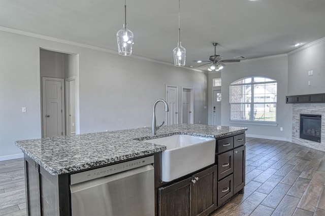 kitchen with ceiling fan, dishwasher, light hardwood / wood-style floors, and sink