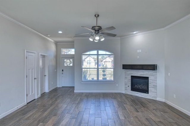 unfurnished living room with dark hardwood / wood-style flooring, ceiling fan, and crown molding