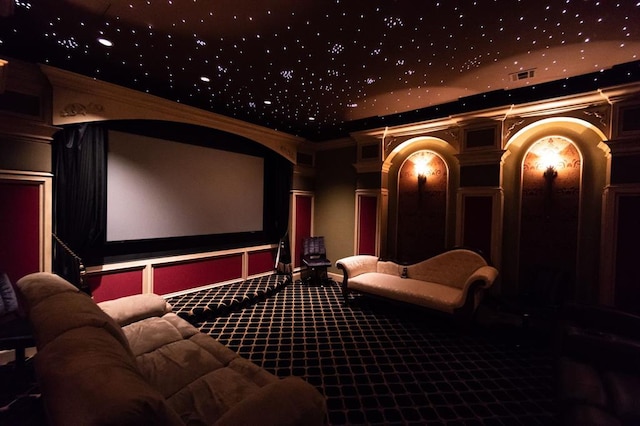 home theater with carpet and crown molding