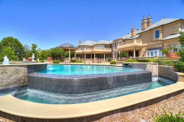 view of swimming pool featuring pool water feature