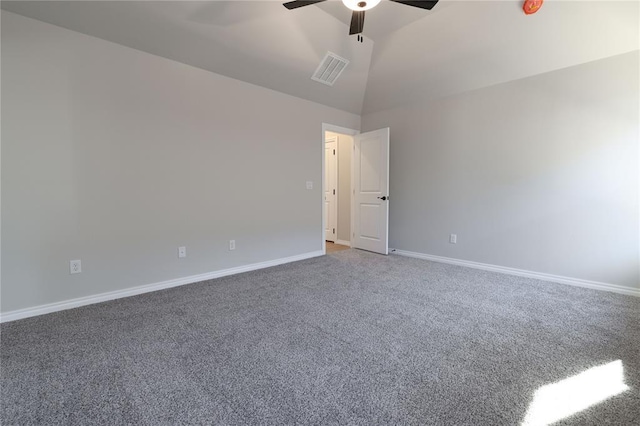 carpeted spare room with ceiling fan and lofted ceiling