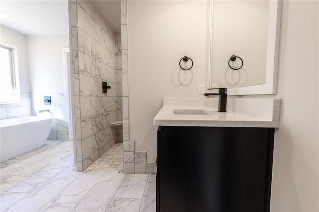 bathroom featuring vanity and shower with separate bathtub