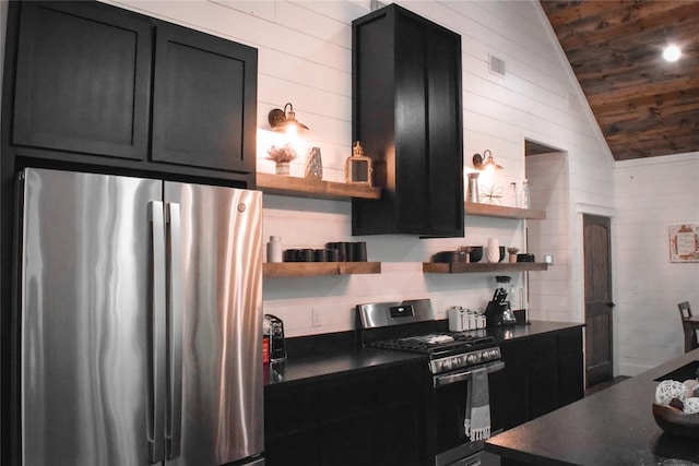 kitchen with wood ceiling, lofted ceiling, and appliances with stainless steel finishes