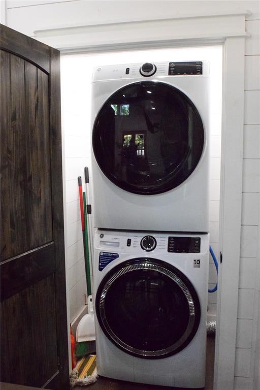 washroom with stacked washer and clothes dryer