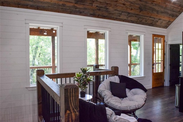 sunroom / solarium featuring wood ceiling, a wealth of natural light, and vaulted ceiling