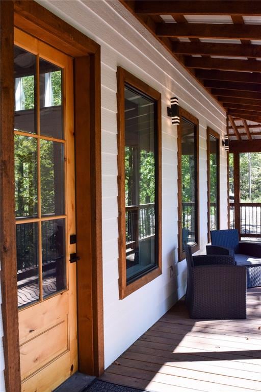 wooden terrace featuring covered porch