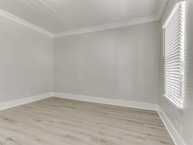 unfurnished room with light wood-type flooring and ornamental molding