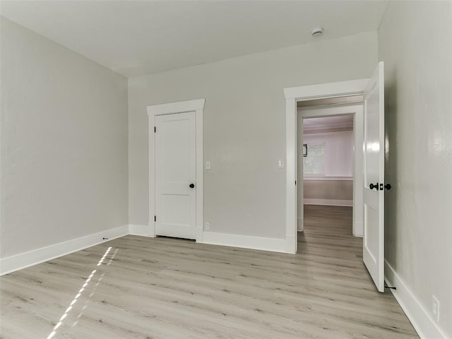 empty room with light wood-type flooring